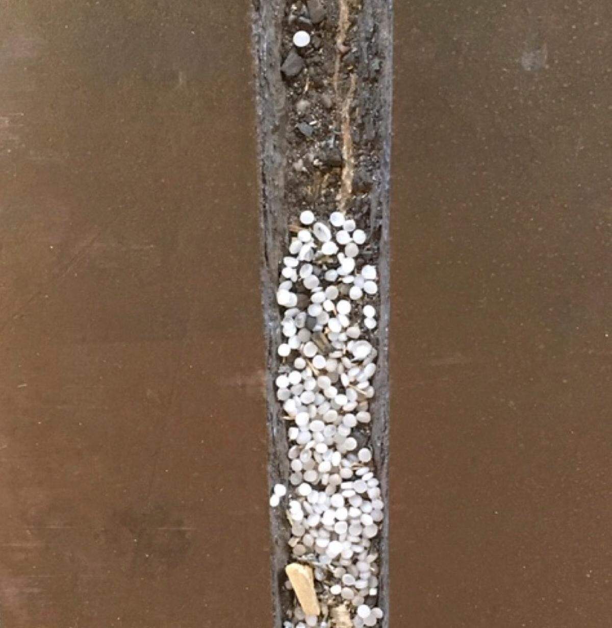 On July 19, DHEC inspectors observed nurdles accumulated on covered seams inside Frontier’s facility.