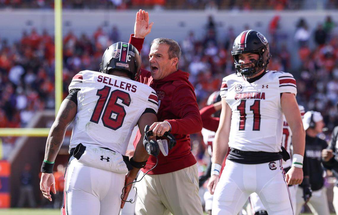 South Carolina head coach Shane Beamer congratulates quarterback LaNorris Sellers (16) on a touchdown during the Palmetto Bowl between at Memorial Stadium in Clemson on Saturday, November 30, 2024.