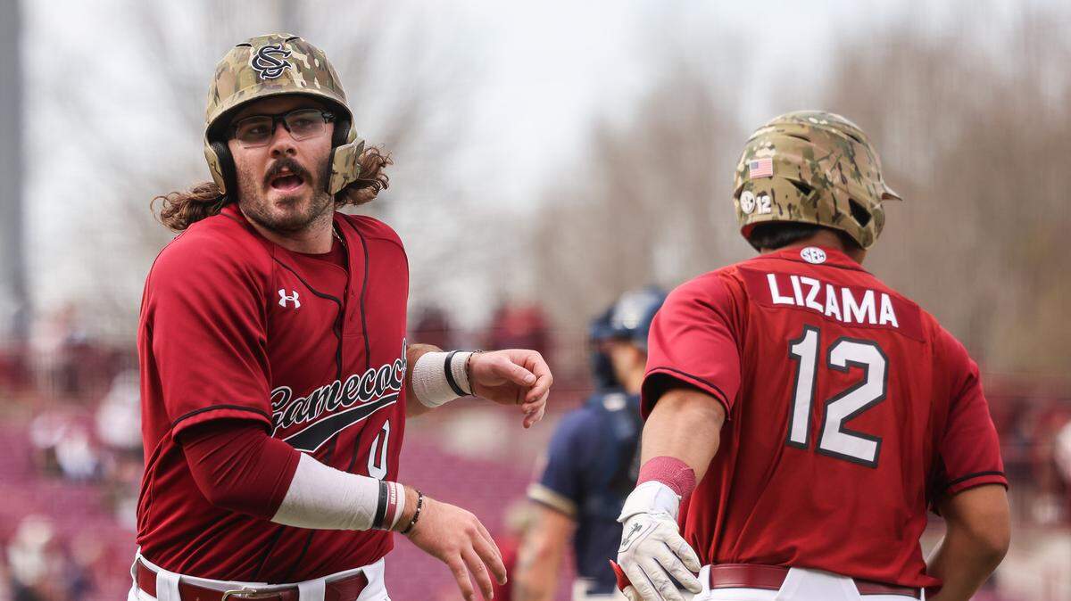South Carolina infielder Logan Sutter (0) scores during South Carolina’s game against Navy at Founders Park in Columbia on Saturday, February 21, 2026.
