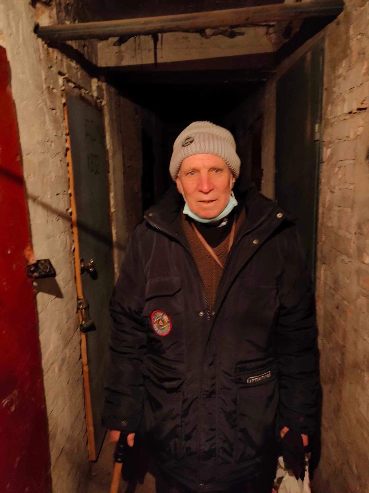 Vasiliy Petrenko, 83, stands in the makeshift bomb shelter in the basement of his apartment building in Nikopol, Ukraine, after Russia invaded the country last week