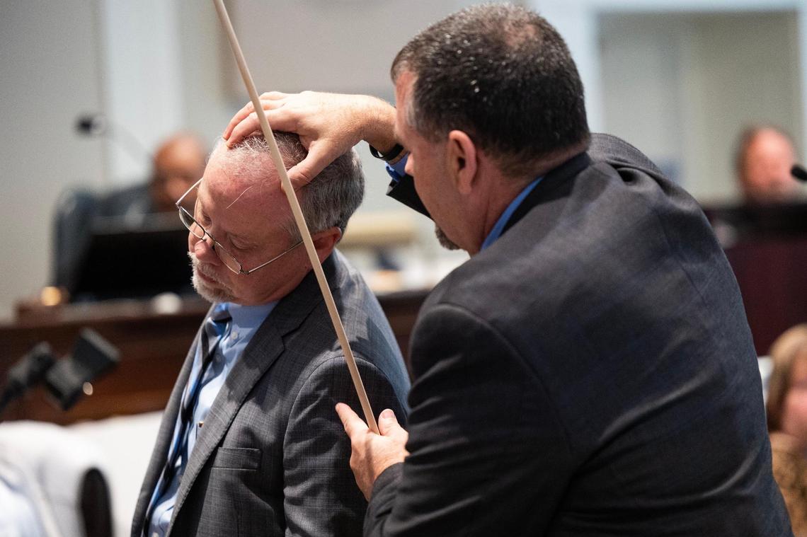 Kenneth Kinsey, crime scene specialist, shows where he believes a shotgun round entered Paul Murdaugh during Alex Murdaugh’s trial for murder at the Colleton County Courthouse on Thursday, February 16, 2023. Joshua Boucher/The State/Pool