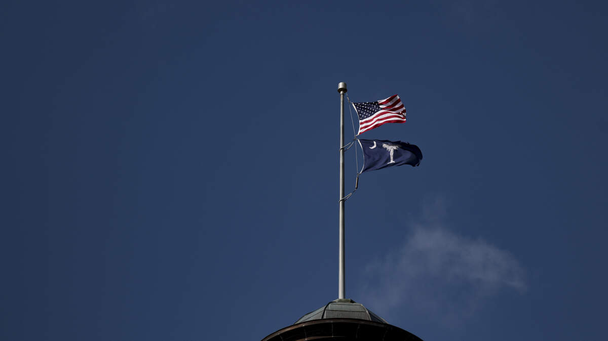 Flags fly on top of The South Carolina State house capitol dome on Tuesday, Jan. 6, 2026.