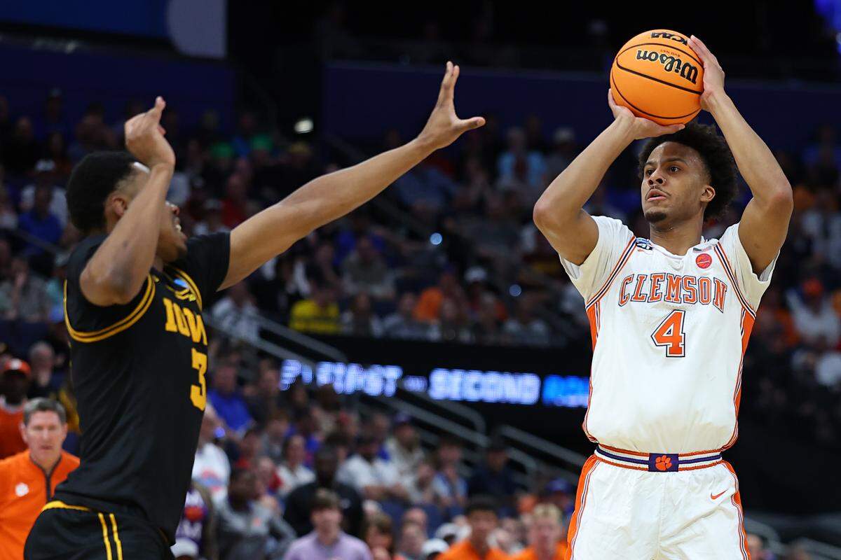 Butta Johnson (4) of the Clemson Tigers shoots the ball against Cam Manyawu (3) of the Iowa Hawkeyes during the first half in the first round of the 2026 NCAA Men's Basketball Tournament at Benchmark International Arena on March 20, 2026 in Tampa, Florida. (Photo by Mike Carlson/Getty Images)