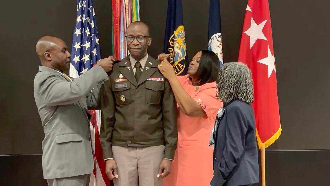 The family of Chaplain (Major General) Bill Green Jr., U.S. Army chief of chaplains, pins on his new rank during a promotion ceremony on March 15 at the U.S. Army Institute for Religious Leadership at Fort Jackson. From left are his brother Calvin Lawyer, wife Robin Green and mother Mary Green.