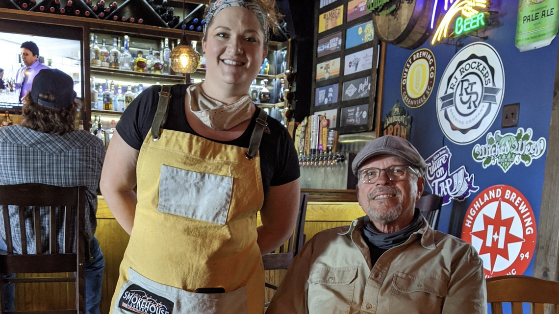 Sarah McClure and her father, Robbie, are shown in Southside Smokehouse. Robbie McClure opened the restaurant in 2004.