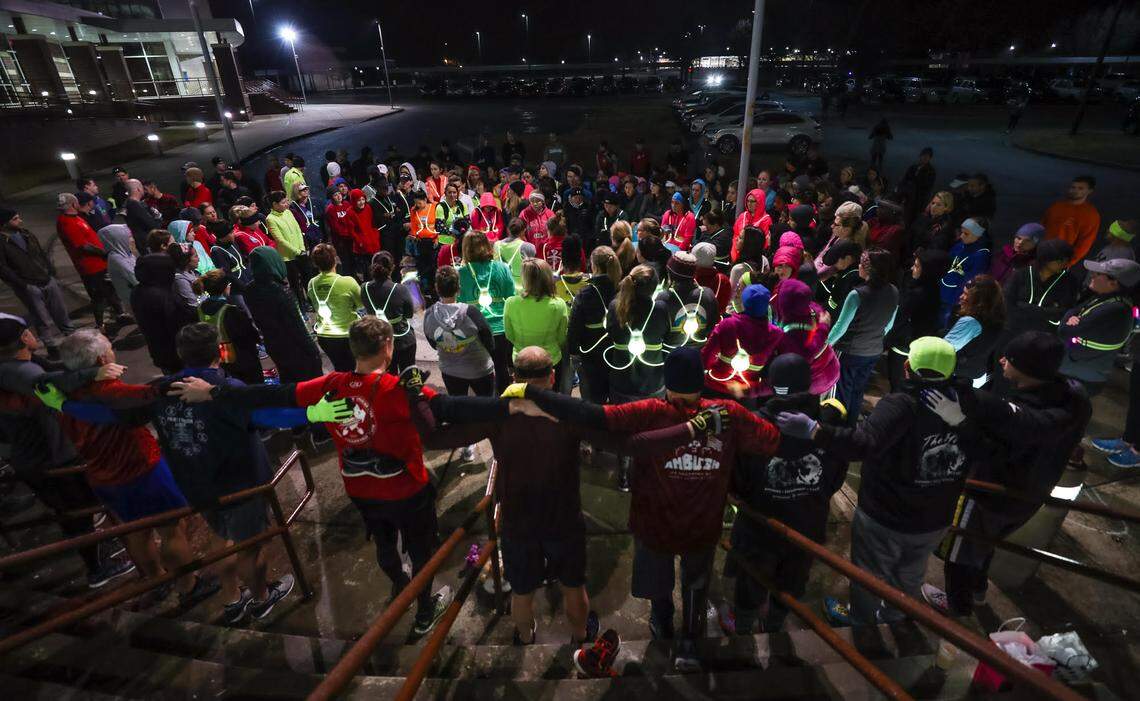 Over 100 runners gathered near Lexington High School to join in a prayer circle for Dianne Sullivan Wells, 36, who was crossing U.S. 1 near Lexington High School around 5 a.m. Tuesday when she was fatally struck by a truck. They also brought ‘retired’ running shoes and made a memorial tree on the side of the road. 12/20/18