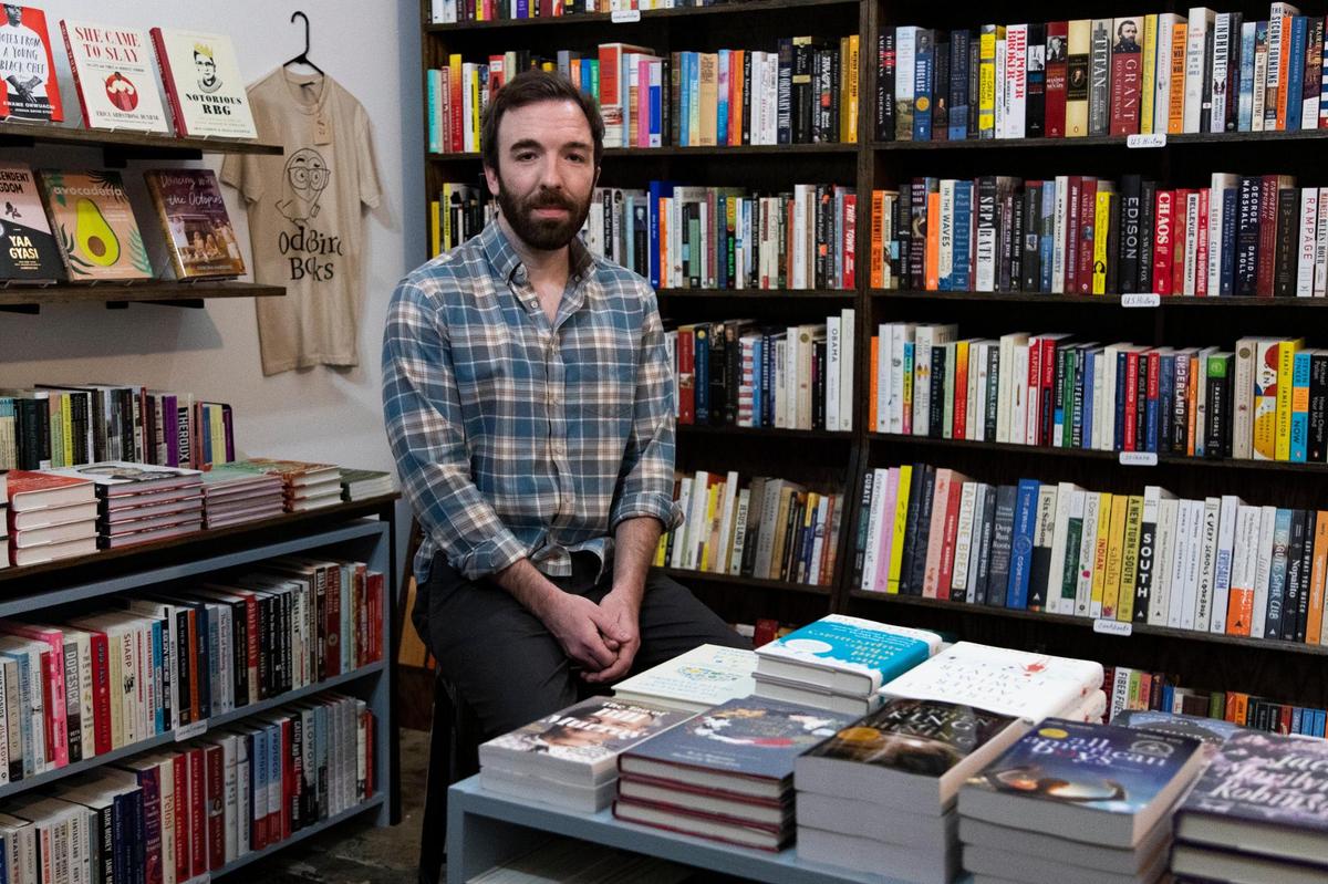 Odd Bird Books owner Benjamin Adams poses for a portrait at his bookstore on Saturday, November 7, 2020. Independent bookstores have faced similar problems as other retailers during the coronavirus pandemic, amplified by their small size and reliance on events.