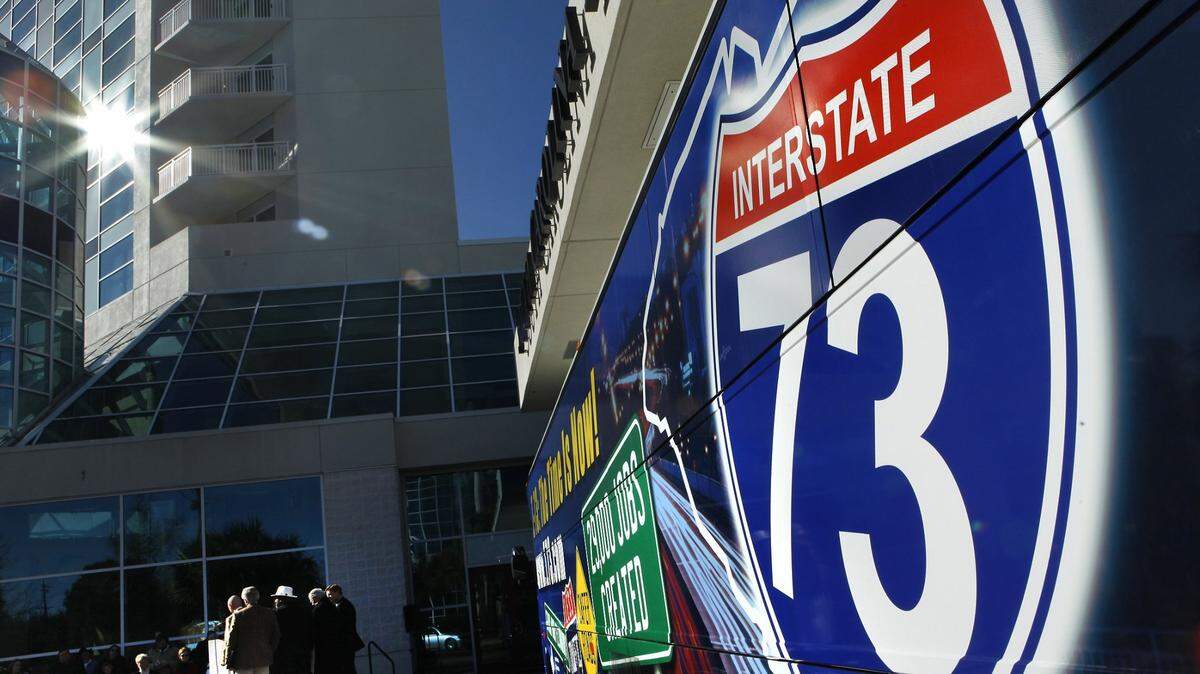 A Shrink-wrapped tour bus with Interstate 73 promos. File photo by Steve Jessmore