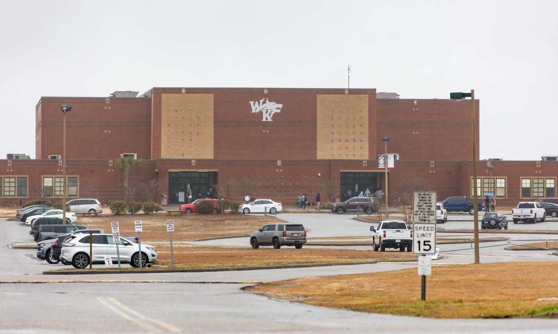 White Knoll High School parents and guardians pick up students Thursday morning after students were sent home due to a threat to the school and several others in the area Feb. 2, 2023.
