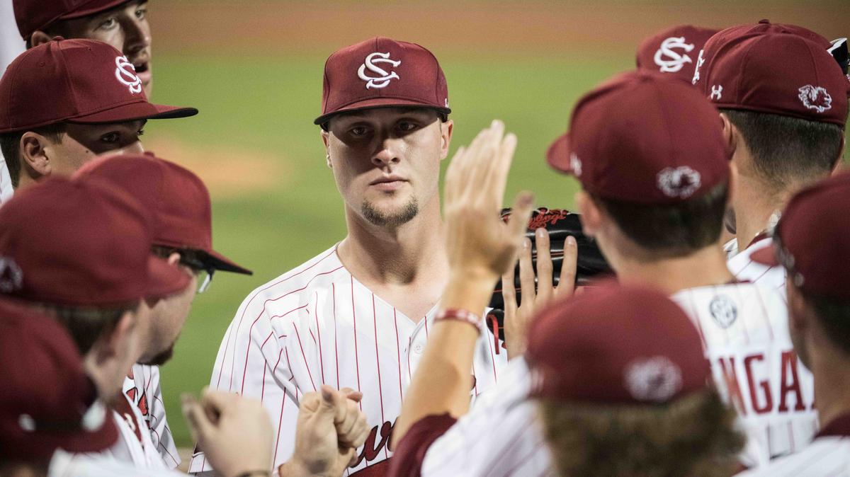 South Carolina starting pitcher Logan Chapman is greeted to the dugout by teammates against Mississippi at Founders Park, Friday May 4, 2018 in Columbia, S.C.