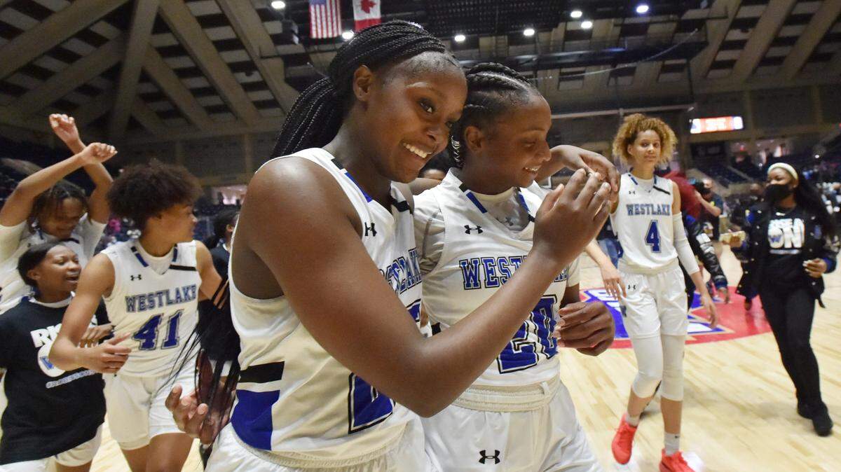 From March 12, 2021: Westlake players Raven Johnson (25) and Ta’Niya Latson (20) celebrate their victory over Carrollton during the 2021 GHSA State Basketball Class 6A Girls Championship game at the Macon Centreplex in Macon, Georgia.