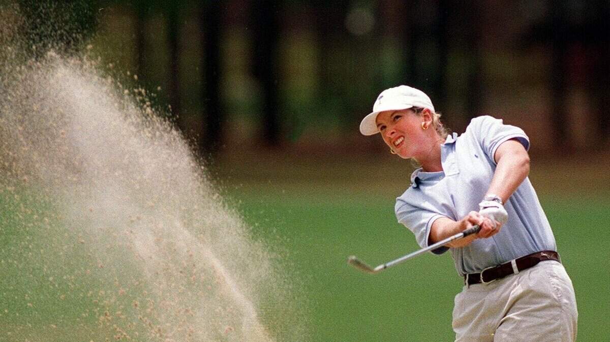 (6/17/99 City Golf) Cecelia Barksdale takes a bunker shot on 14th hole Thursday during the Women’s City Golf Championship at Woodlands Country Club. Barksdale won the tournanment. (Takaaki Iwabu / The State)