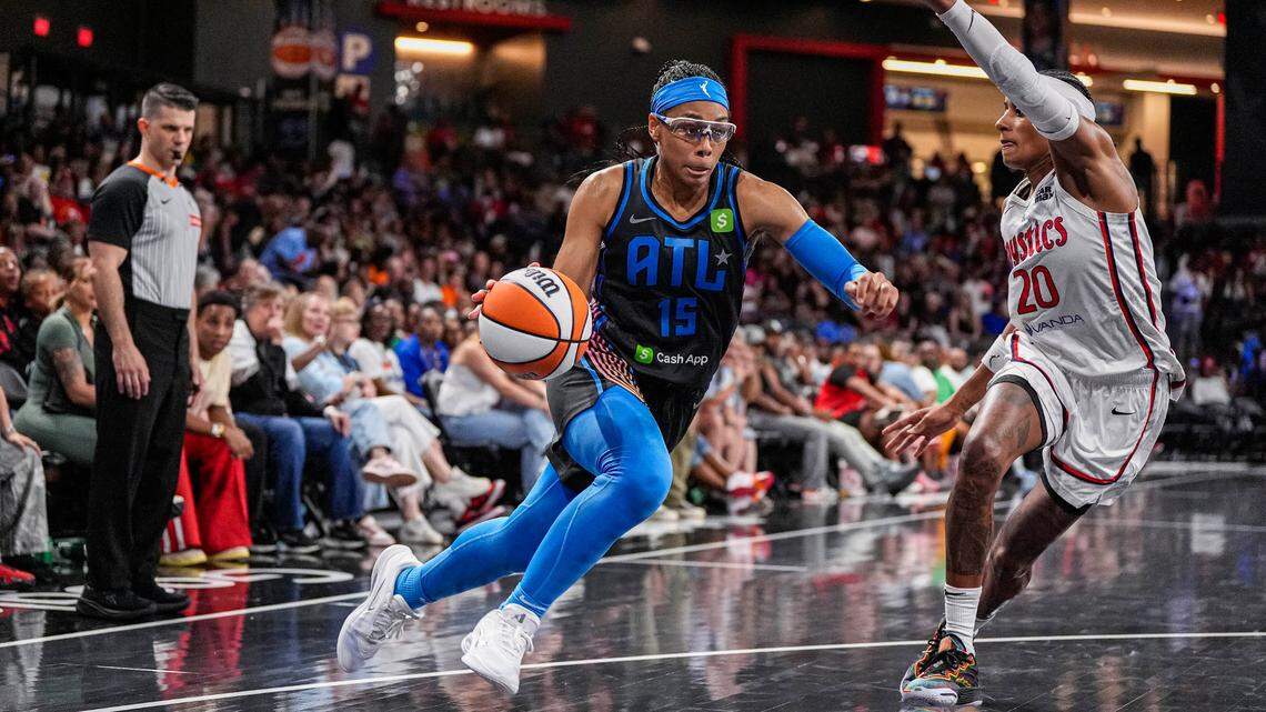 Jun 20, 2025; College Park, Georgia, USA; Atlanta Dream guard Allisha Gray (15) dribbles against Washington Mystics guard Brittney Sykes (20) during the second half at Gateway Center Arena at College Park.