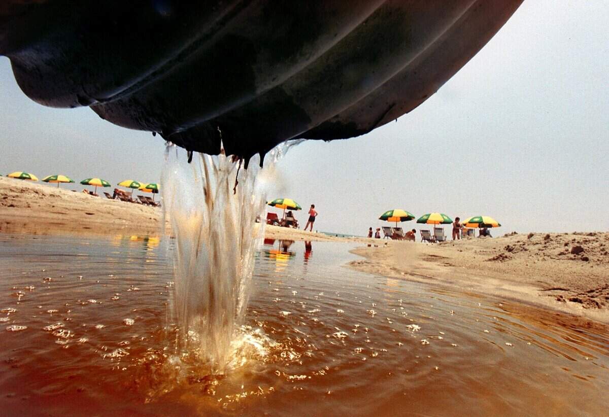 Disease-carrying bacteria can soar on beaches, lakes and rivers after heavy rains, raising threats to people who swim there. Pipes in urban areas often direct polluted water from the land into nearby bodies of water, like the Congaree and Saluda Rivers near Columbia and the ocean at Myrtle Beach. This photo, taken in 2001, shows drainage water pouring onto the seashore at Myrtle Beach.