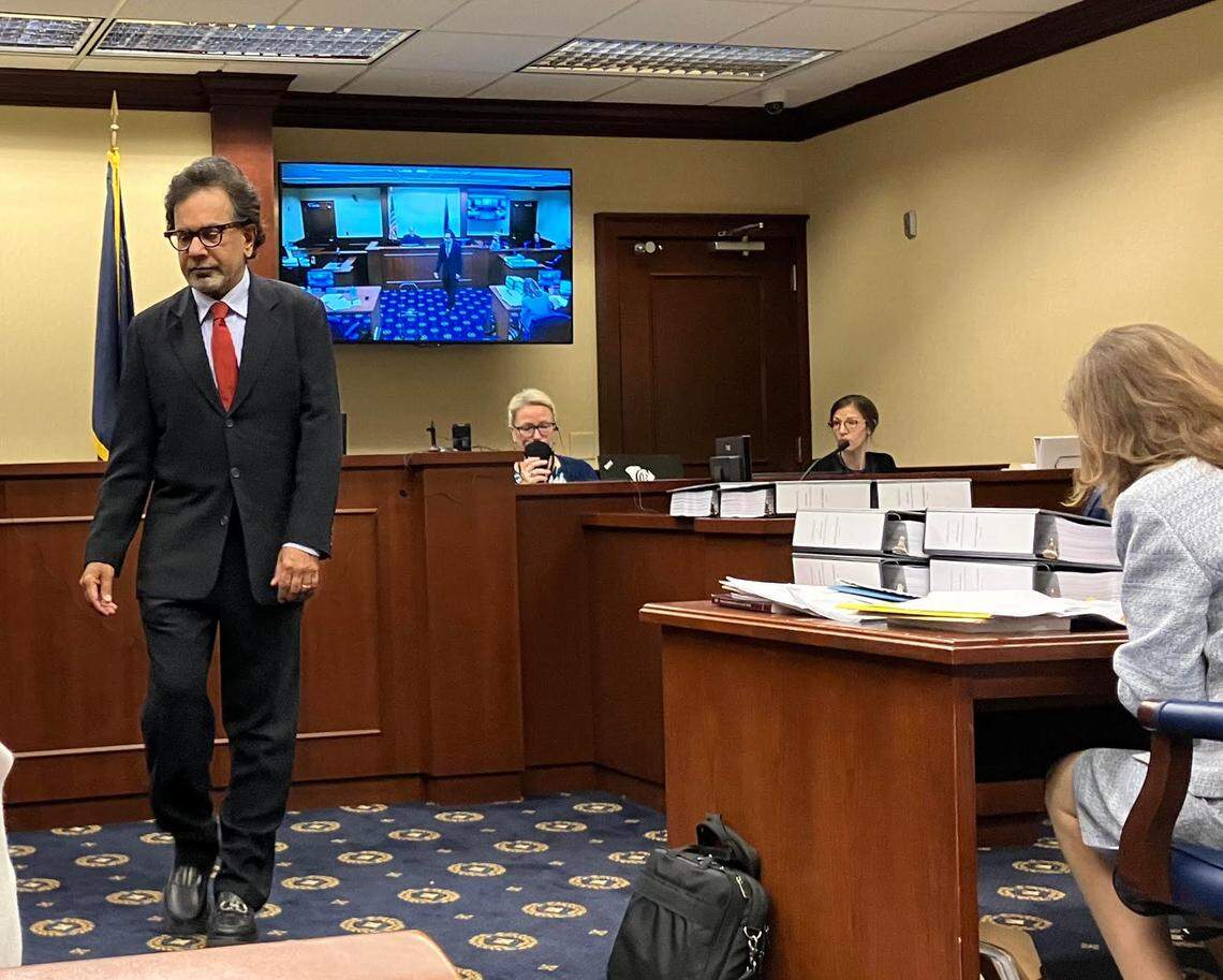 Isle of Palms property owner Rom Reddy, in dark suit, appeared in the state Administrative Law Court on Tuesday May 6, representing himself without a lawyer in a state enforcement case against him. State environmental officials say he built a seawall illegally on the beach, but Reddy is fighting the allegation, saying the wall was legal.