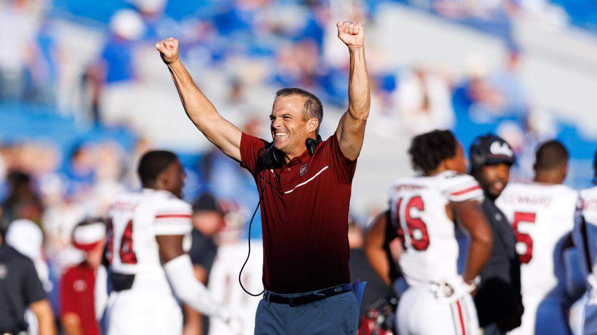 South Carolina Gamecocks head coach Shane Beamer celebrates during the fourth quarter against the Kentucky Wildcats at Kroger Field.