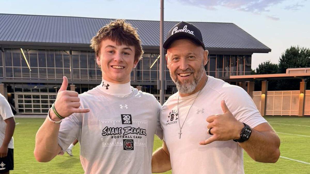 Class of 2028 wide receiver recruit Jaytn Briles (left) and South Carolina football wide receivers coach Mike Furrey (right)
