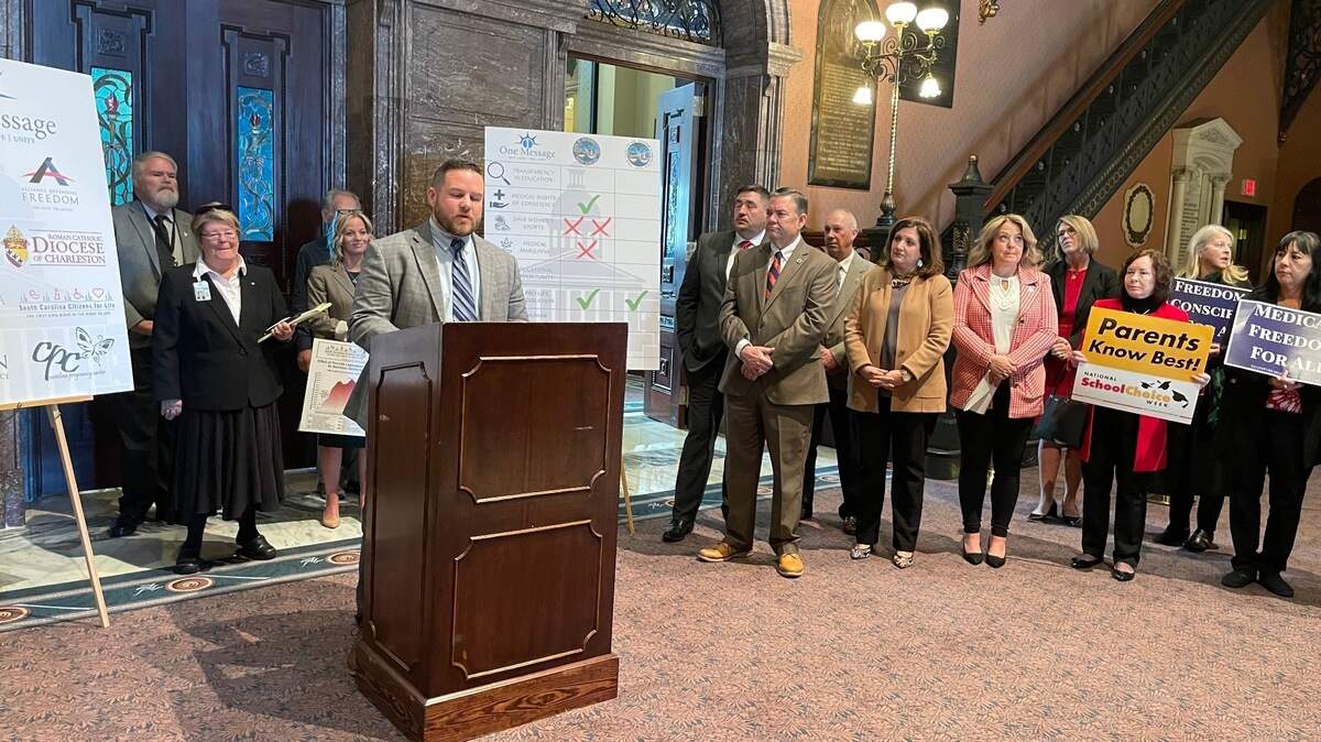 South Carolina Rep. RJ May, R-Lexington, center, speaks Wednesday, Jan. 12, 2021, at the State House in Columbia, S.C., about 2022 priorities.