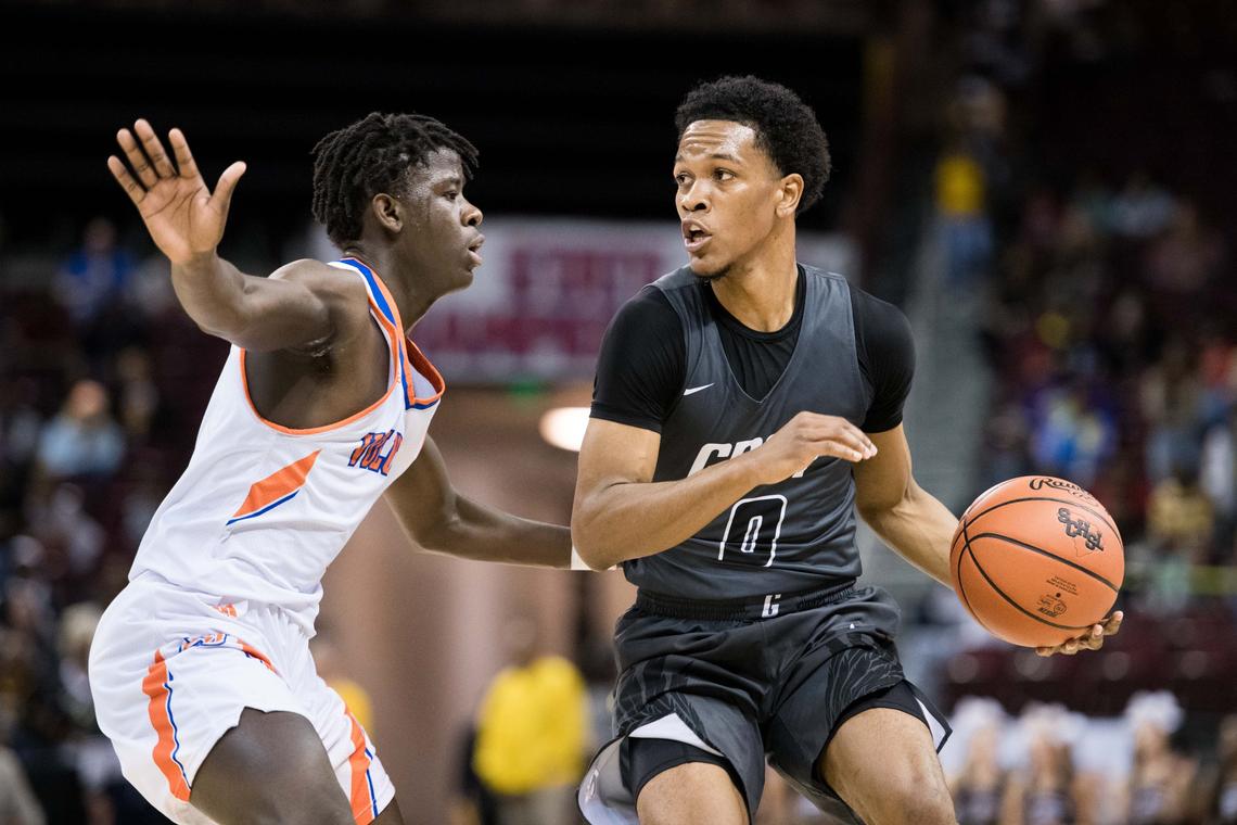 Gray Collegiate guard Tommy Bruner dribbles the ball against Andrew Jackson guard DJ Ealey Saturday.
