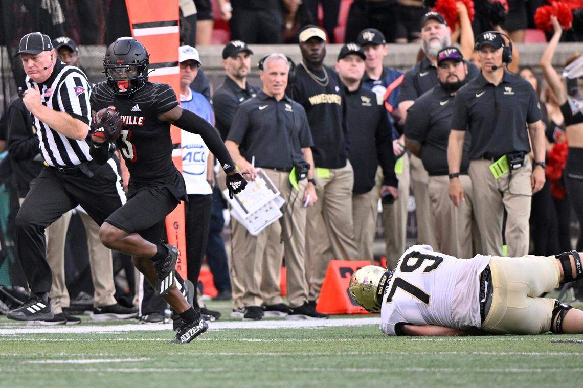 Oct 29, 2022; Louisville, Kentucky, USA;  Louisville Cardinals cornerback Quincy Riley (3) returns an interception for a touchdown against the Wake Forest Demon Deacons during the second half at Cardinal Stadium. Louisville defeated Wake Forest 48-21.