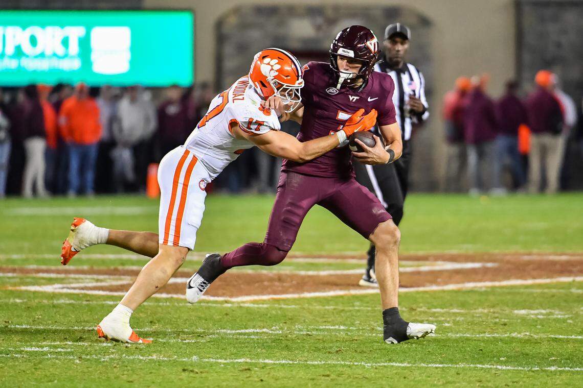 Nov 9, 2024; Blacksburg, Virginia, USA; Clemson Tigers linebacker Wade Woodaz (17) tackles Virginia Tech Hokies quarterback Collin Schlee (3) during the fourth quarter at Lane Stadium.