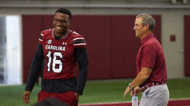 South Carolina quarterback LaNorris Sellers (16) laughs with head coach Shane Beamer during media day in Columbia on Thursday, August 1, 2024.