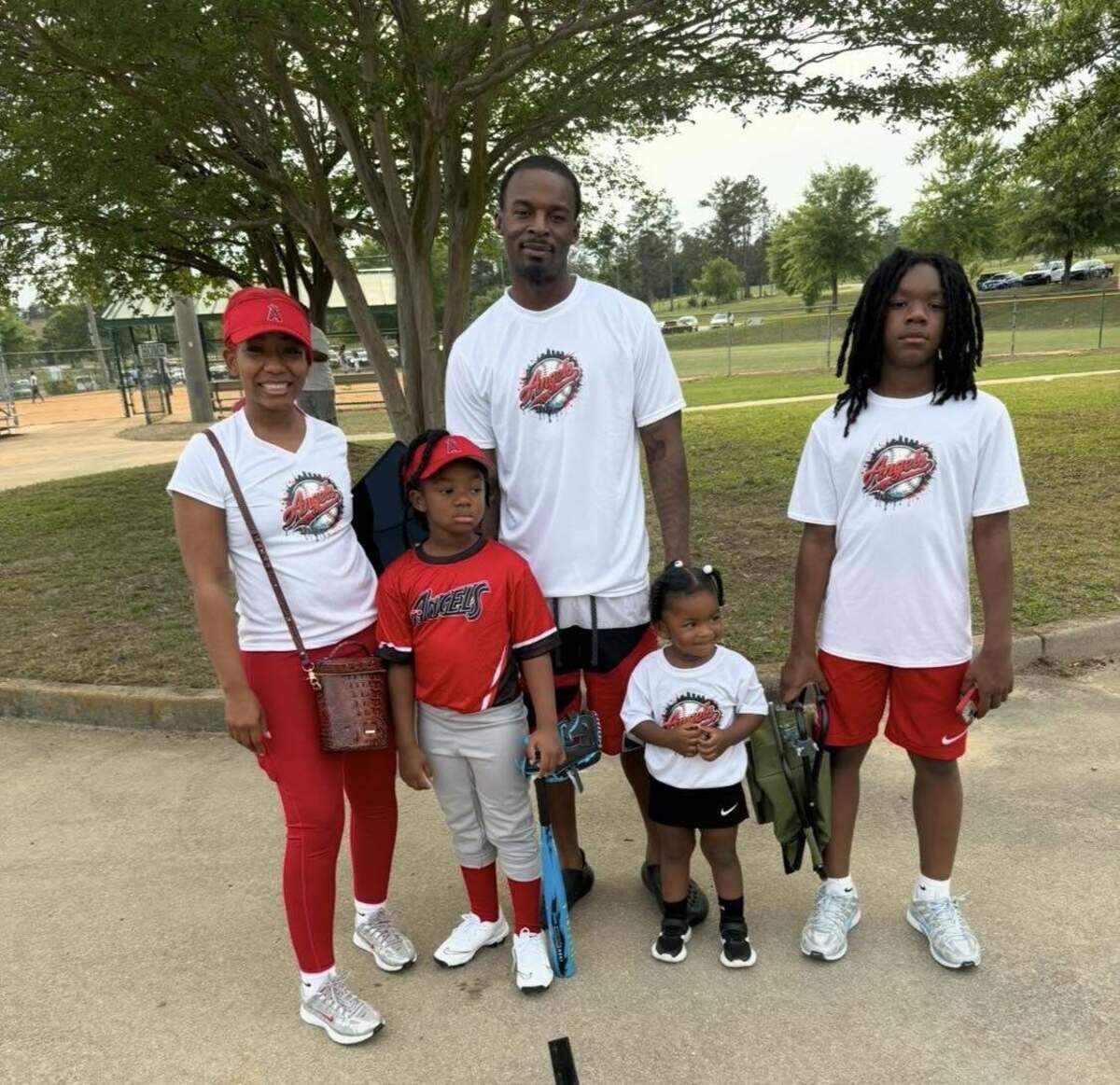 Former Clemson men’s basketball player Rod Hall with his girlfriend, Swann Brown, and their children