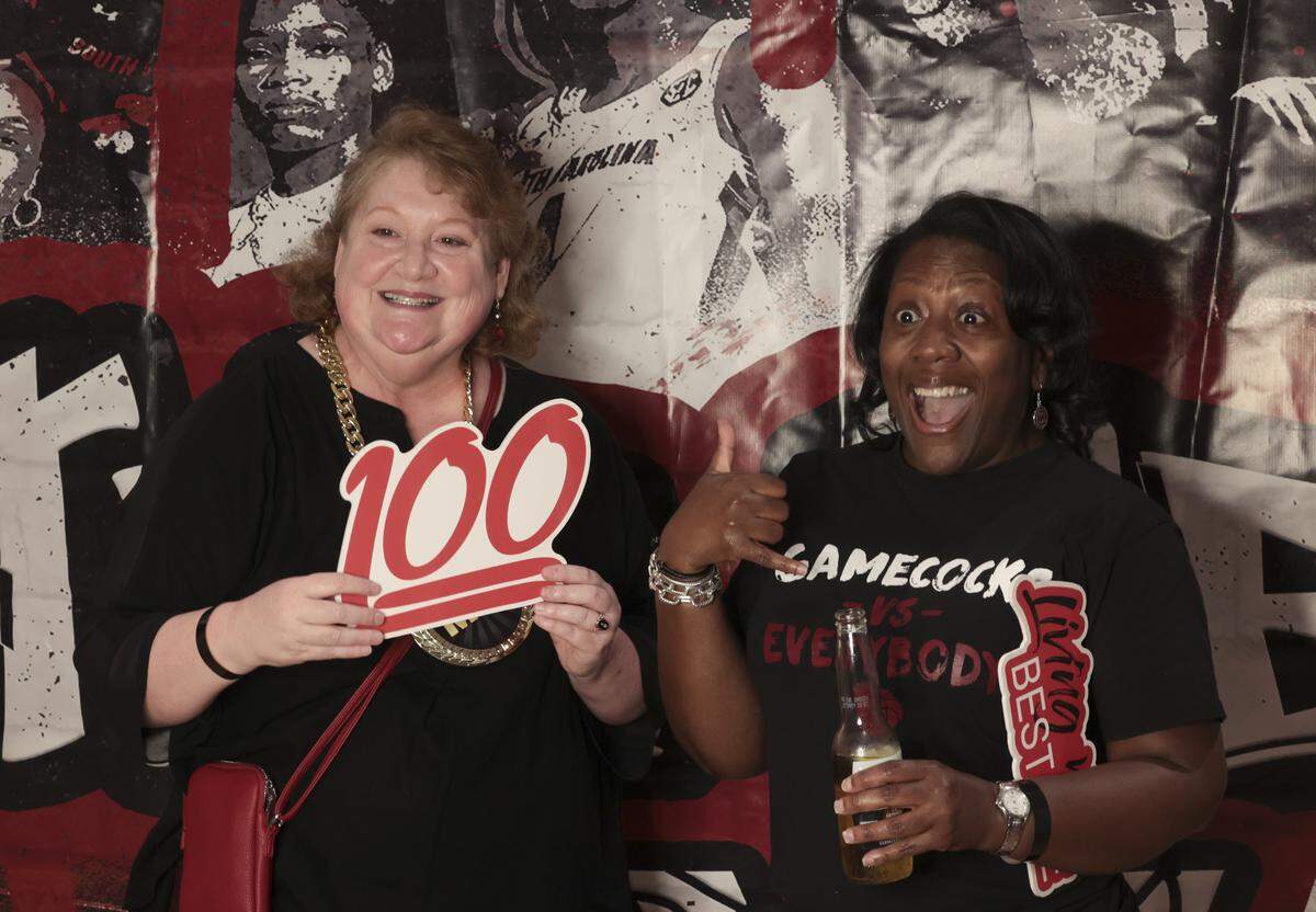Meg Eliatamby and Sholanda Fowler pose in a Photo Booth during a watch party for the Gamecocks women’s basketball team at the Columbia Museum of Art on Sunday, March 15, 2026.