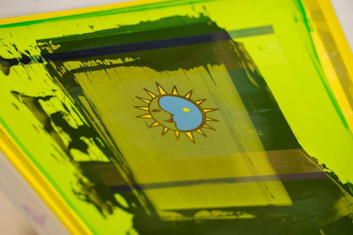 Participants in the The Turn 90 program operate a screen printing shop to gain employment skills. Turn 90 helps with the reentry process by helping formerly incarcerated men with life skills.