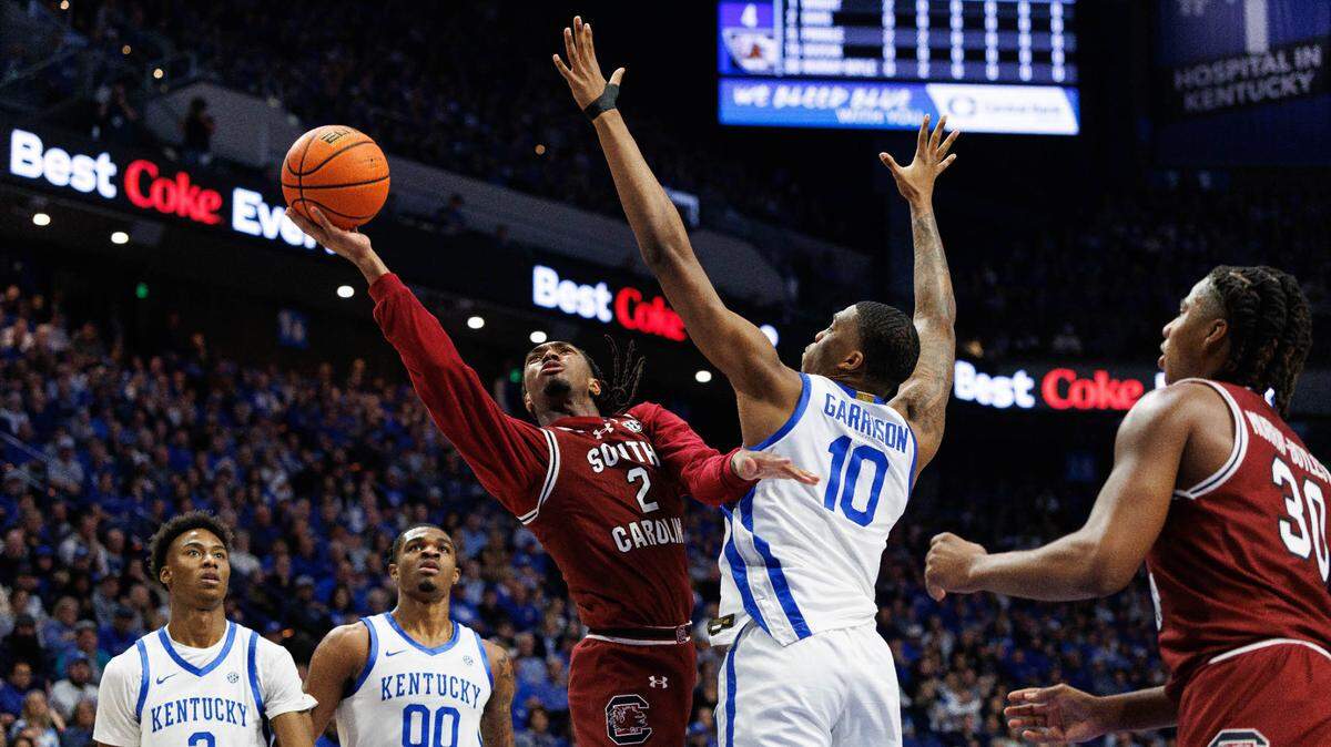 Feb 8, 2025; Lexington, Kentucky, USA; South Carolina Gamecocks guard Zachary Davis (2) shoots the ball against Kentucky Wildcats forward Brandon Garrison (10) during the first half at Rupp Arena at Central Bank Center. Mandatory Credit: Jordan Prather-Imagn Images