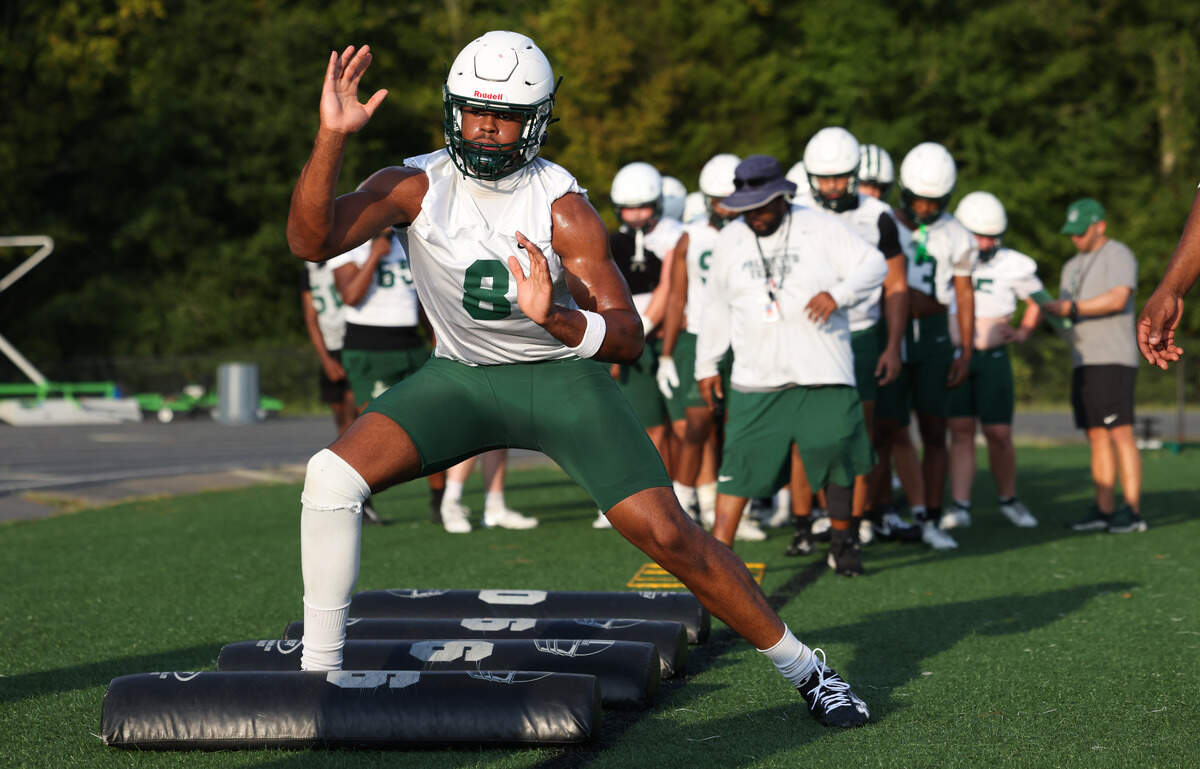 Dutch Fork defensive end Julian Walker (8) runs drills during practice at Dutch Fork.