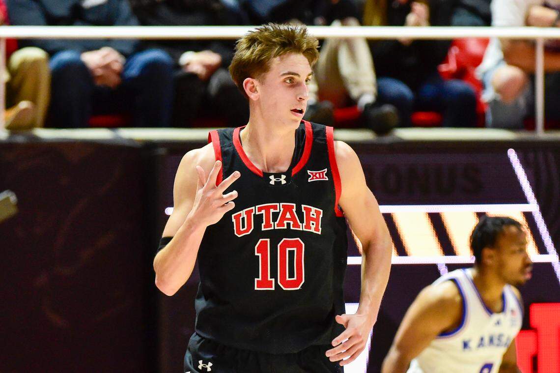 Feb 15, 2025; Salt Lake City, Utah, USA; Utah Utes forward Jake Wahlin (10) reacts to a three-point basket against the Kansas Jayhawks during the first half at the Jon M. Huntsman Center.