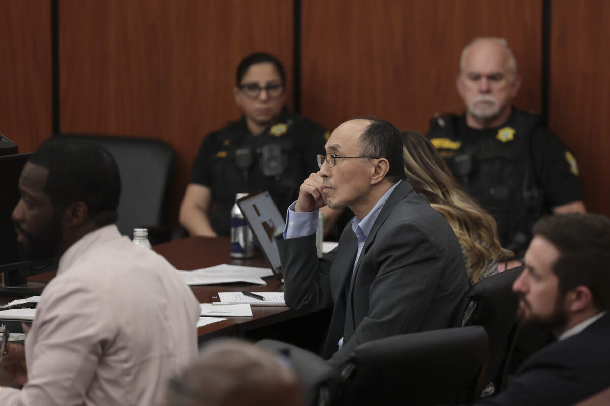 Rick Chow sits with his attorneys during his trial on Friday, May 29, 2026. Chow is being tried for shooting and killing Cyrus Carmack-Belton in 2023.