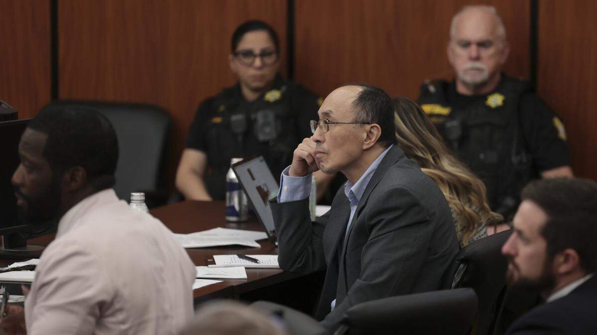 Rick Chow sits with his attorneys during his trial on Friday, May 29, 2026. Chow is being tried for shooting and killing Cyrus Carmack-Belton in 2023.