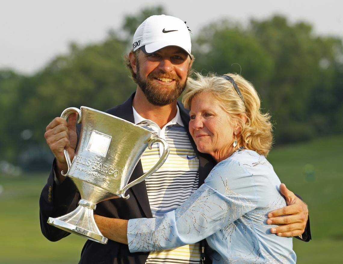 Lucas Glover, left, gets a hug from his mother, Hershey Glover, after winning the Wells Fargo Championship golf tournament at Quail Hollow Club in Charlotte, N.C., Sunday, May 8, 2011.