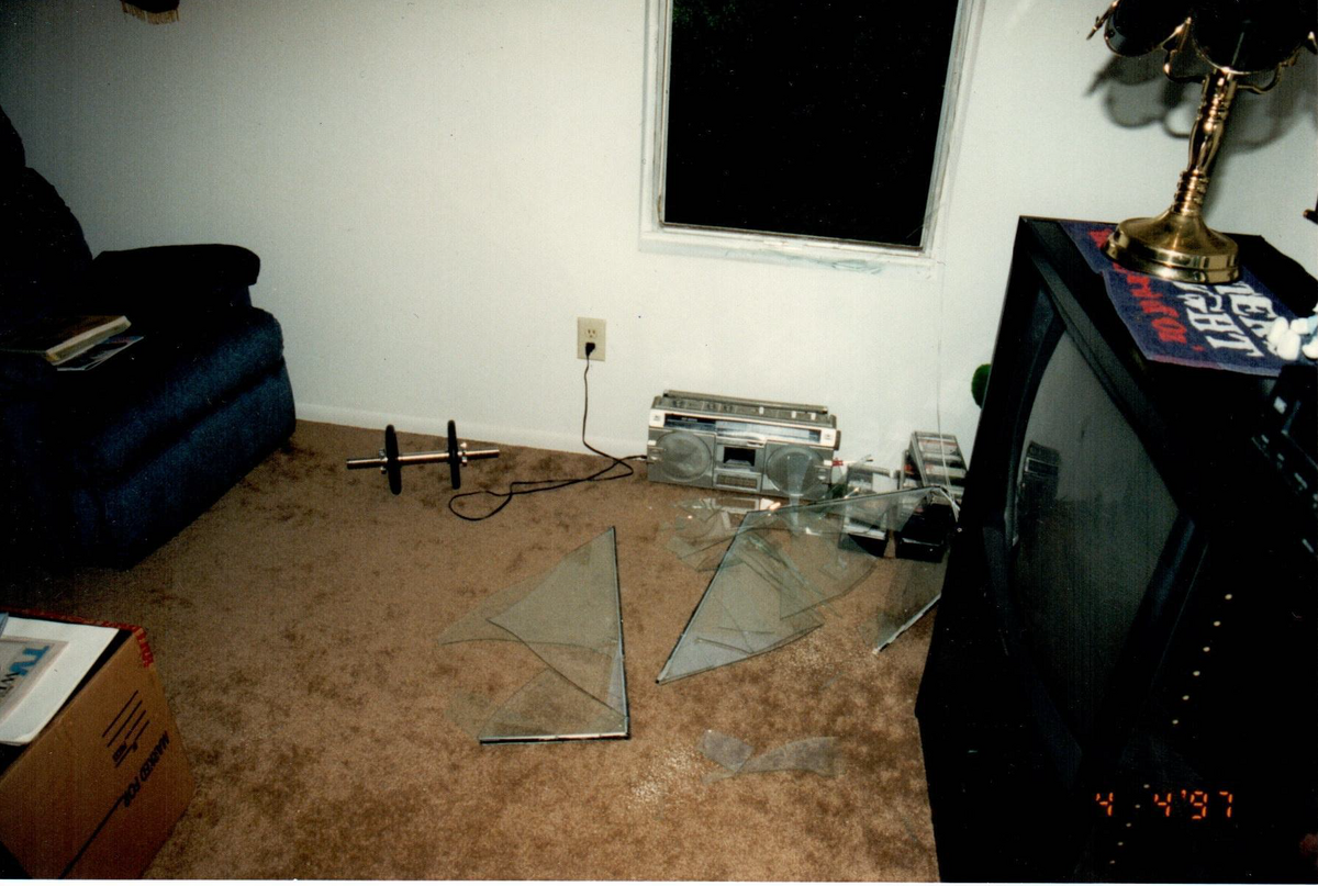 A picture of the broken window inside of Sharon Emory’s apartment in Spartanburg, South Carolina taken after Frye’s attack on April 4, 1997.