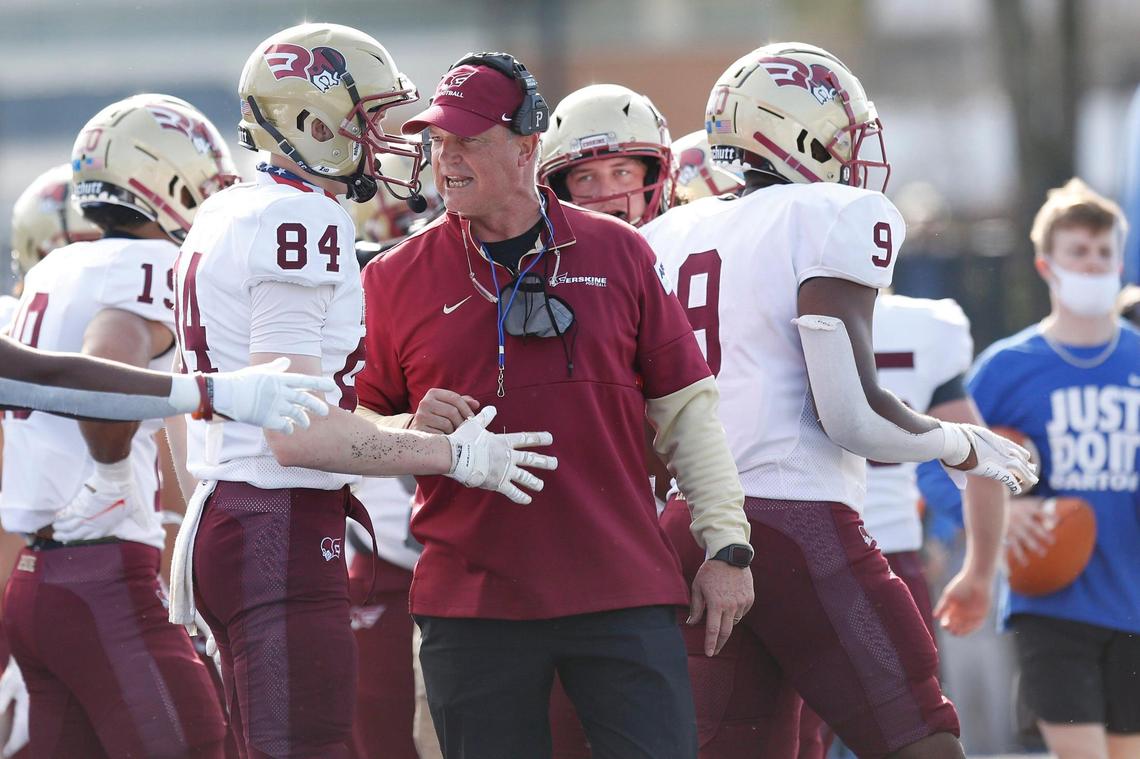 Erskine Flying Fleet head coach Shap Boyd speaks to wide receiver Derek Gill (84) on the sidelines in the second quarter of the game Saturday.