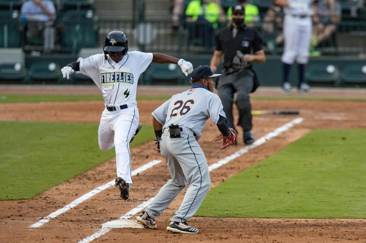 The Columbia Fireflies’ Diego Hernandez 4 jumps onto first as the Charleston RiverDogs’ Alexander Ovalles 26 tags him out at Segra Park on Tuesday, May 11, 2021.