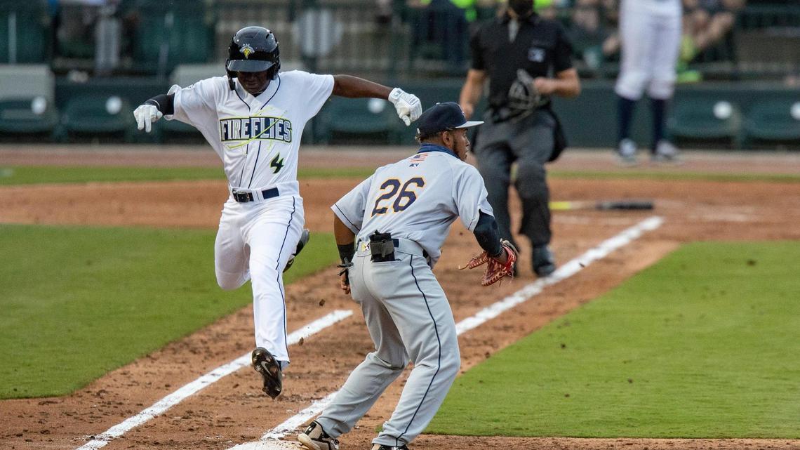 The Columbia Fireflies’ Diego Hernandez 4 jumps onto first as the Charleston RiverDogs’ Alexander Ovalles 26 tags him out at Segra Park on Tuesday, May 11, 2021.