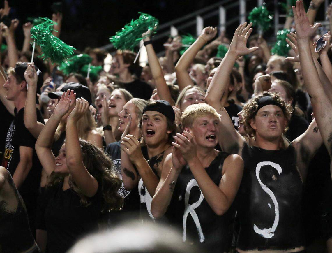 Catawba Ridge students cheer during a Friday night football game at The Pit.