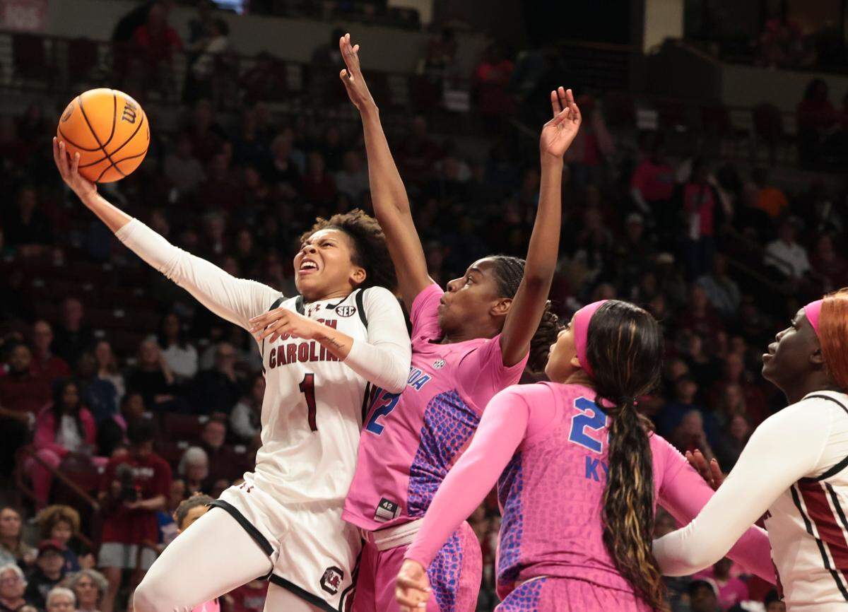 University of South Carolina’s Maddy McDaniel (1) shoots as Florida’s Daviane Mindoudi Ongbakahoumb (12) pressures during the second half of action in the Colonial Life Arena on Thursday, Feb. 13, 2025. The Gamecocks won, 101-63.