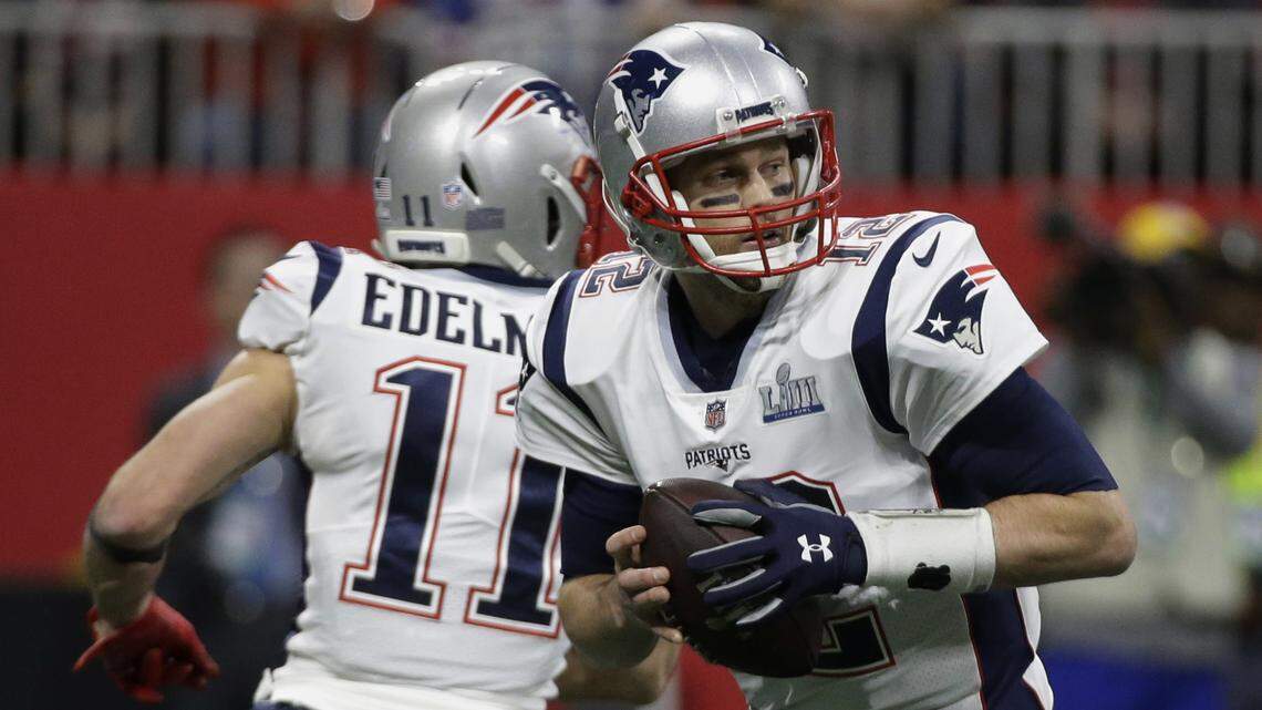 New England Patriots’ Tom Brady (12) looks to pass, during the first half of the NFL Super Bowl LIII.