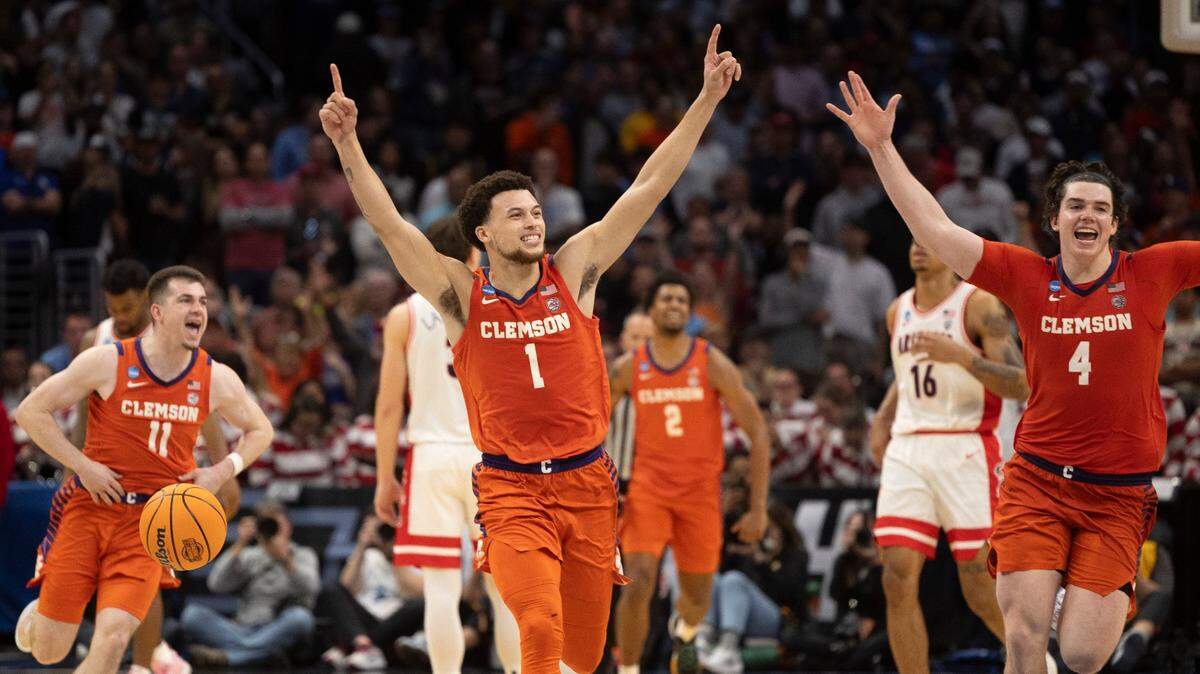 Clemson’s Joseph Girard III (11), Chase Hunter (1) and Ian Schieffelin (4) celebrate the Tigers’ 77-72 victory over Arizona in the NCAA Sweet Sixteen on Thursday, March 28, 2024 at Crypto.com Arena in Los Angeles, CA.