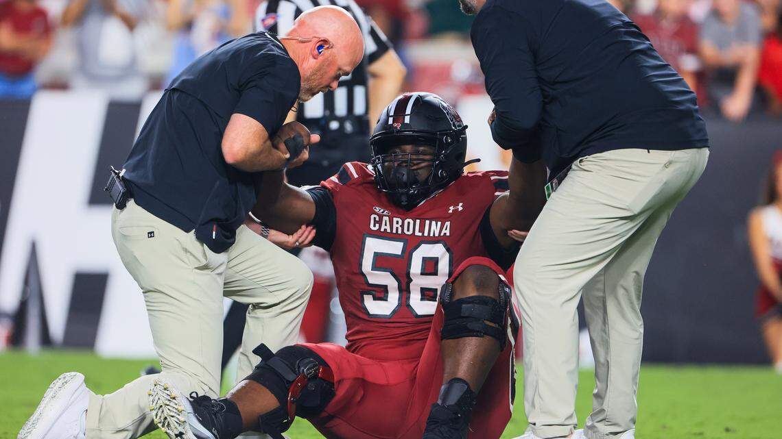 South Carolina offensive lineman Markee Anderson (58) is helped back on to his feet during the game against SC State at Williams-Brice Stadium on Saturday, September 6, 2025.