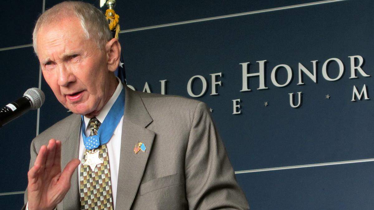Medal of Honor recipient retired Maj. Gen. James Livingston speaks aboard the aircraft carrier USS Yorktown in Mount Pleasant, S.C., on Wednesday, Aug. 1, 2012. (AP Photo/Bruce Smith).