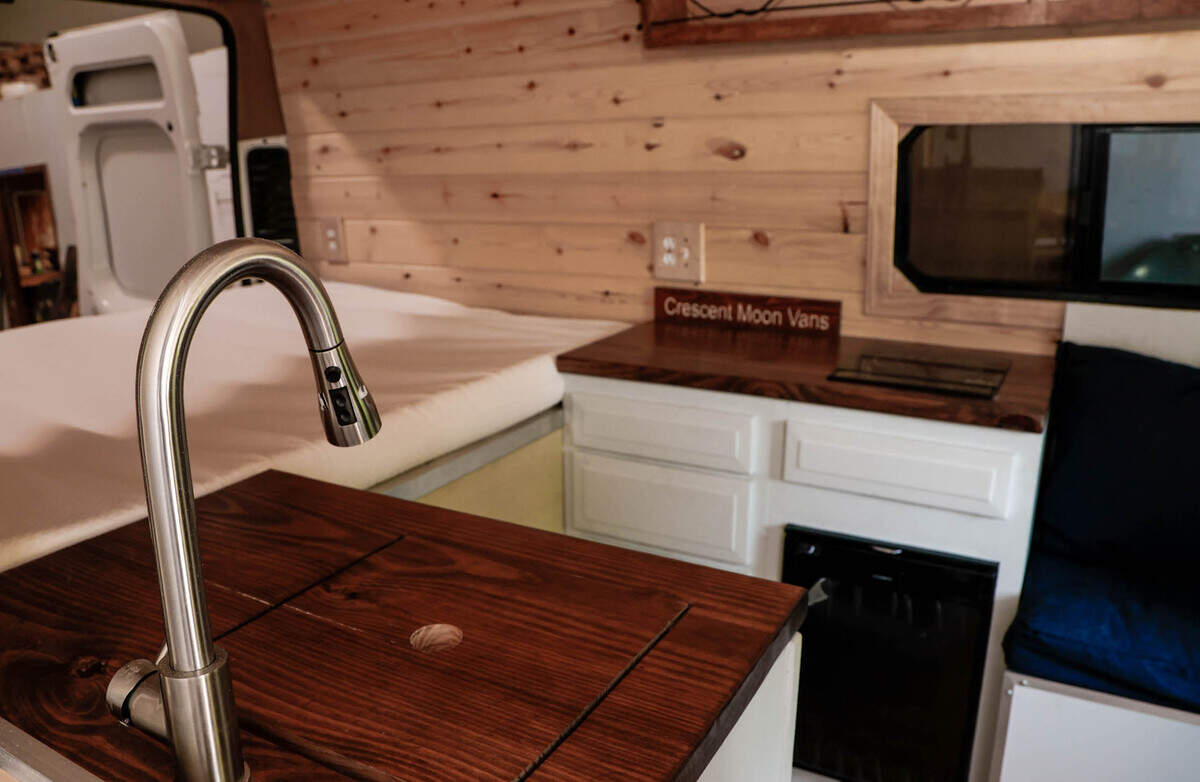 Matthew Alburn started a business while in school at the University of South Carolina converting cargo vans into living spaces. The vans include a sleeping area, a stove, sink and refrigerator and storage.