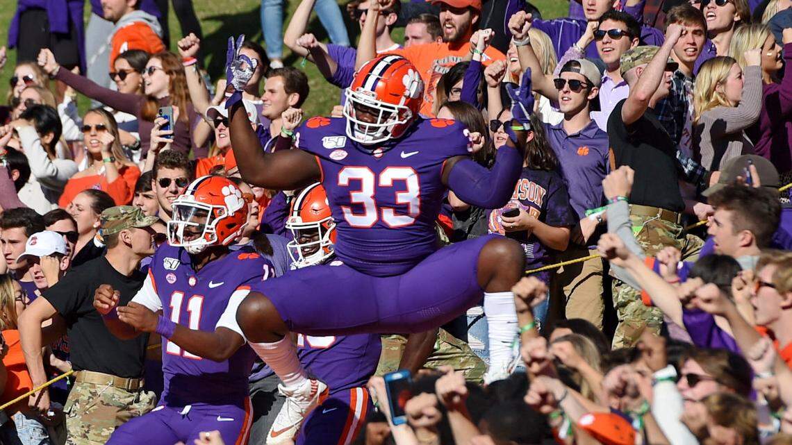 Clemson’s Ruke Orhororo (33) jumps as he runs down “The Hill” before the start of a home game.