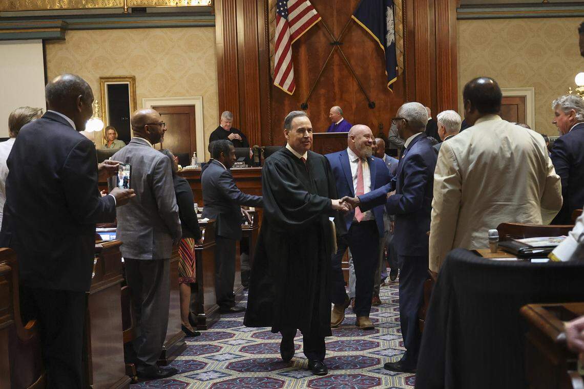 Supreme Court Chief Justice John Kittredge greets members of a joint session of legislators after delivering the State of the Judiciary address on Wednesday, April 15, 2026.