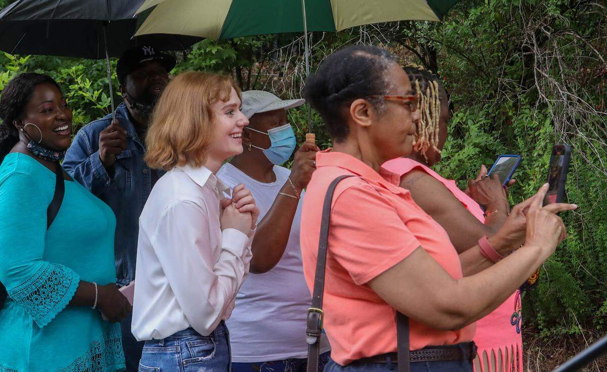 River Bluff student Rachel Loging stands with members of New Mount Zion AME Church as the sign for the Old Mount Zion AME Cemetery is unveiled. Loging and other students worked to clean-up the historic cemetery.