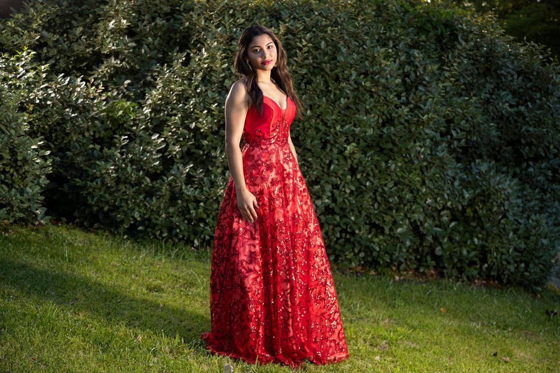 Karisma Virk, a senior at Spring Valley High School, poses for a portrait in her front yard on May 1, 2020. Virk purchased her prom dress planning on also wearing it to compete during the talent portrait of the Miss South Carolina pageant.
